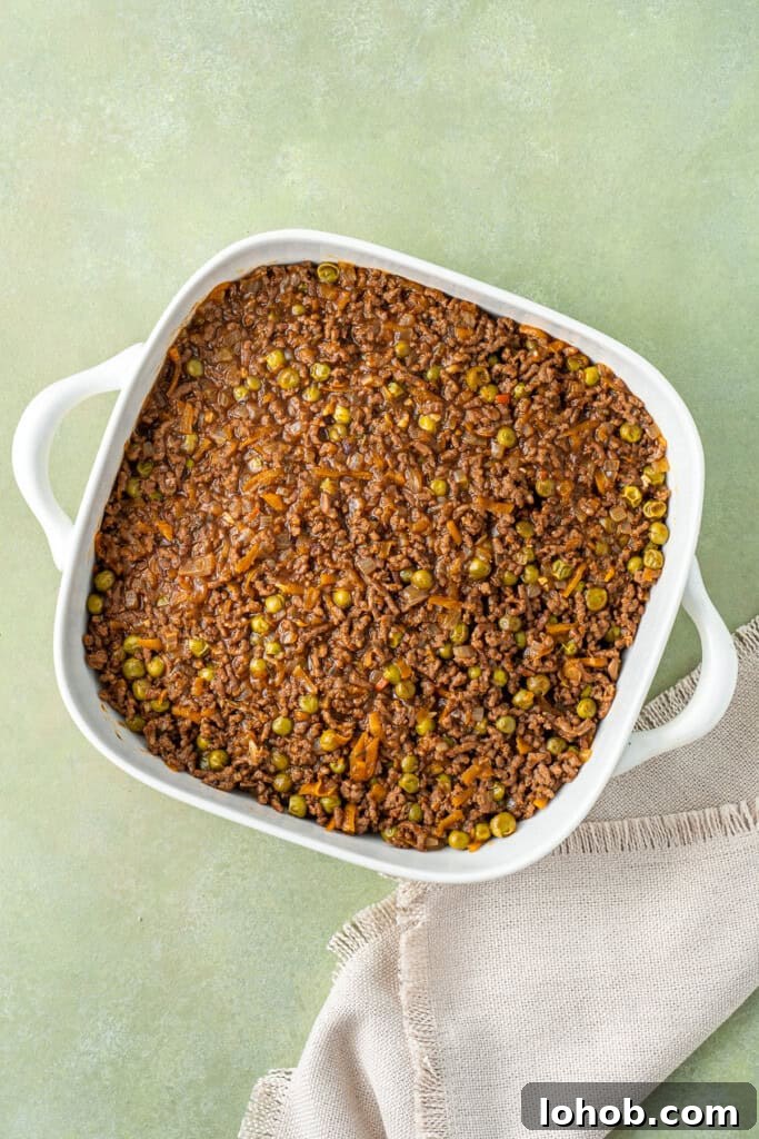 Classic Cottage Pie Recipe with Savory Beef and Mashed Potato Top 11 The pie filling in a dish.