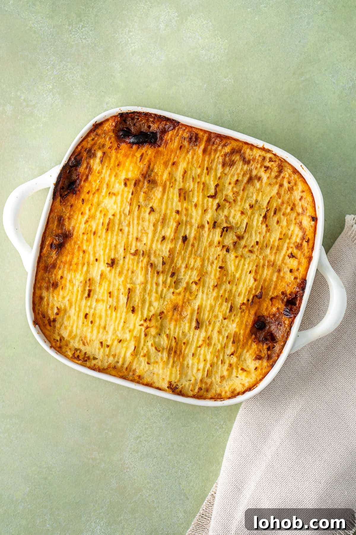 Classic Cottage Pie Recipe with Savory Beef and Mashed Potato Top 13 Cottage pie baked and golden brown on top.