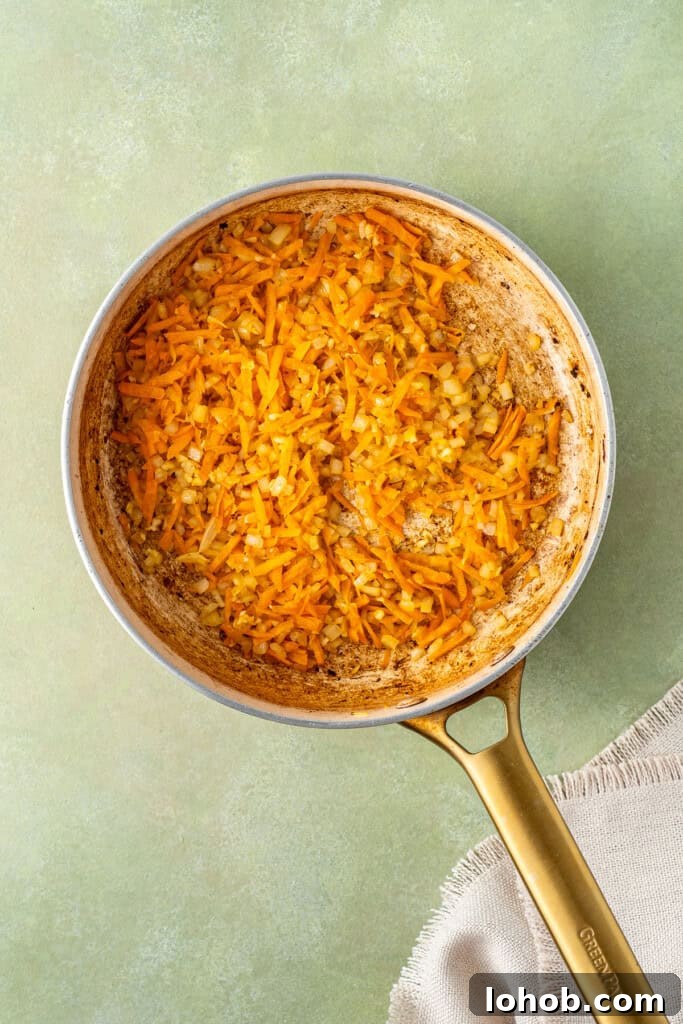 Classic Cottage Pie Recipe with Savory Beef and Mashed Potato Top 6 Sautéing the onions and carrots in a frying pan.