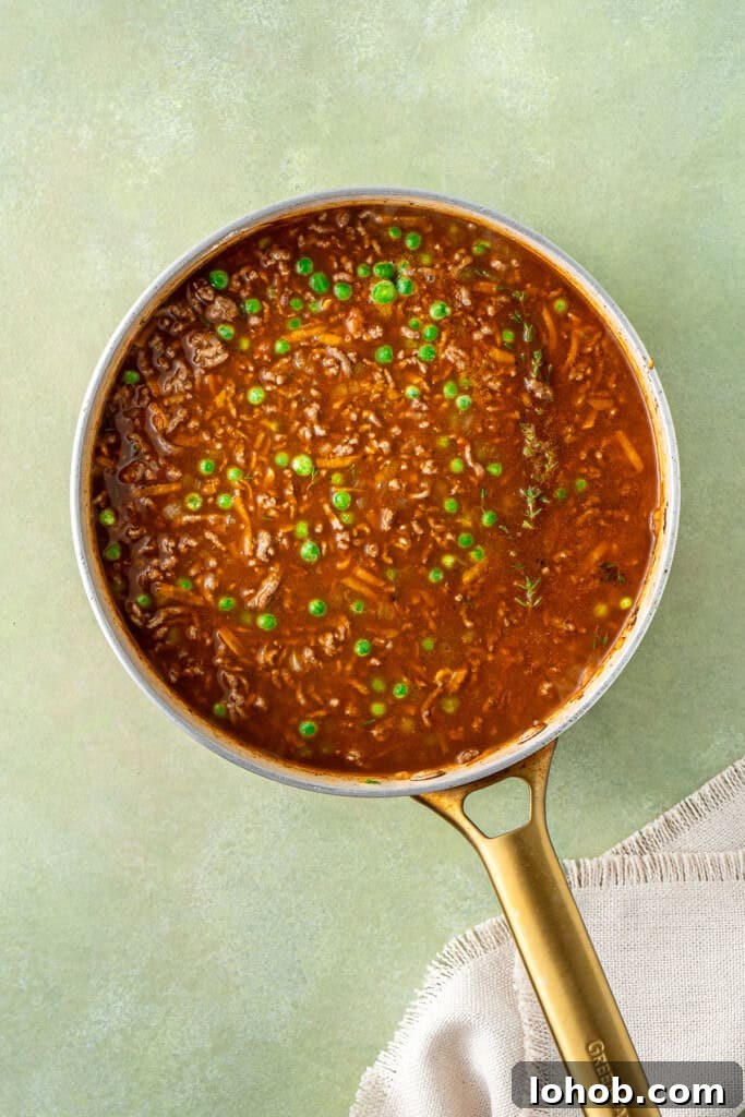 Classic Cottage Pie Recipe with Savory Beef and Mashed Potato Top 7 The liquids added to the mince ready to simmer.