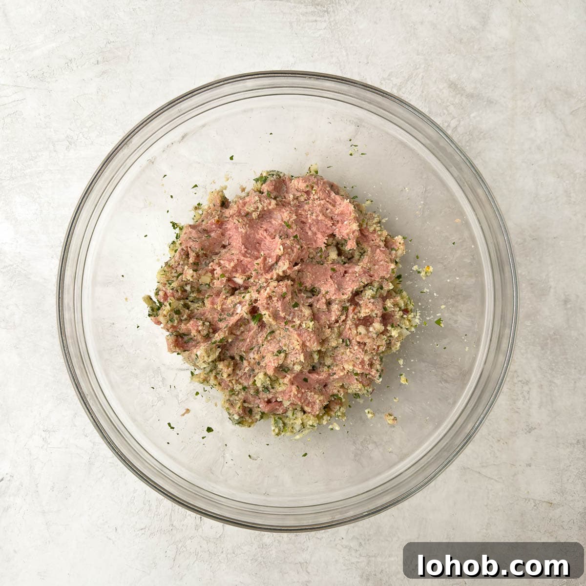 Oven-Baked Turkey Meatballs with Tangy Tomato Sauce 4 Turkey meat with ingredients for meatballs.