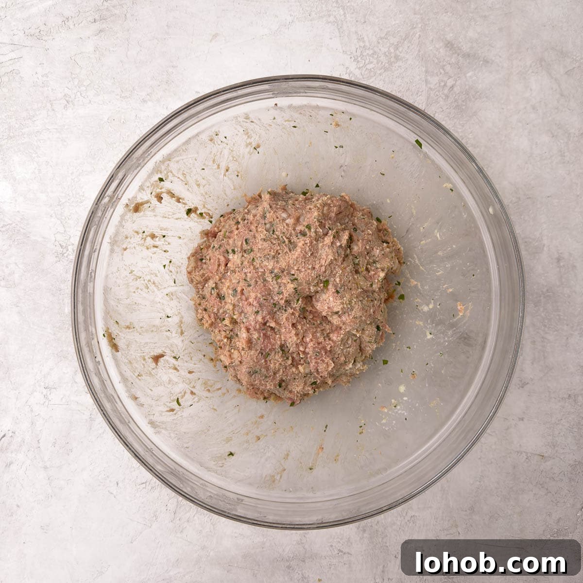 Oven-Baked Turkey Meatballs with Tangy Tomato Sauce 5 Finished meat muxture in a glass bowl, ready to roll into balls.