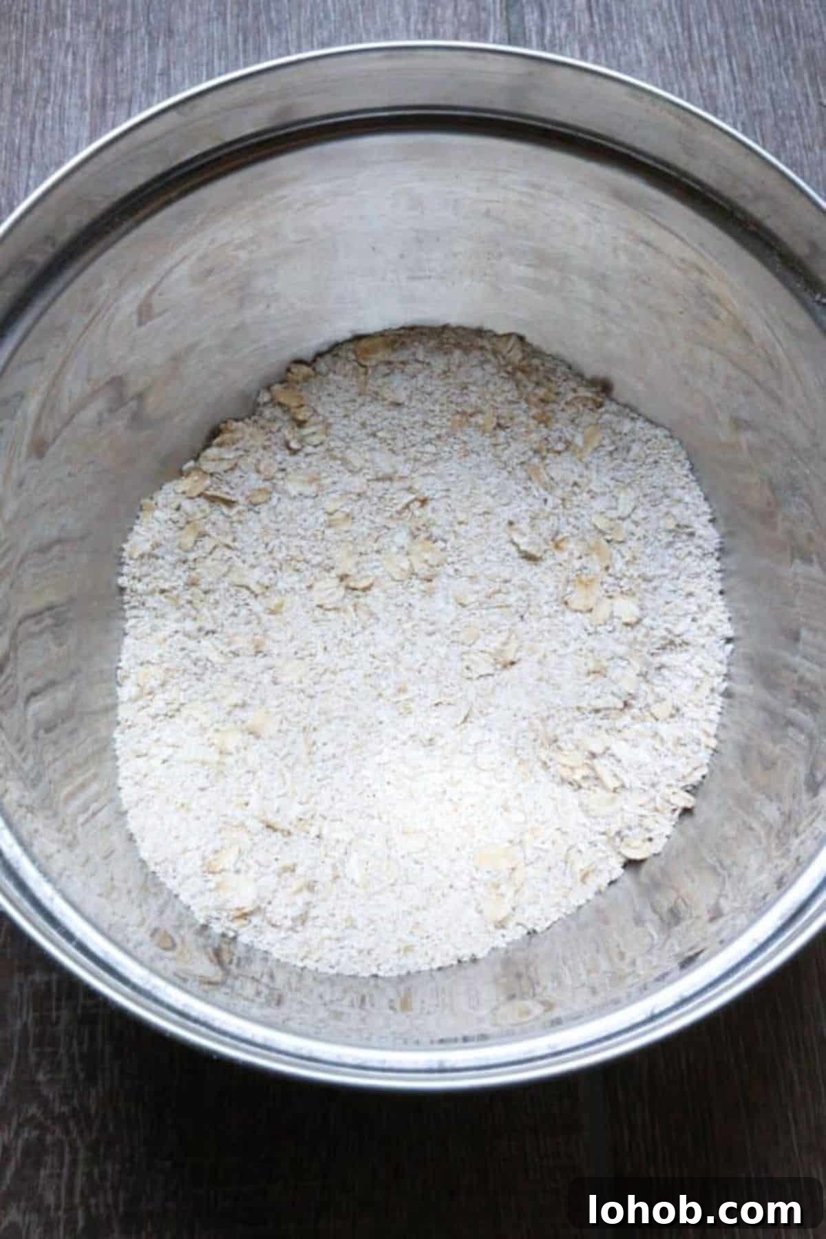 Oat flour in a metal bowl