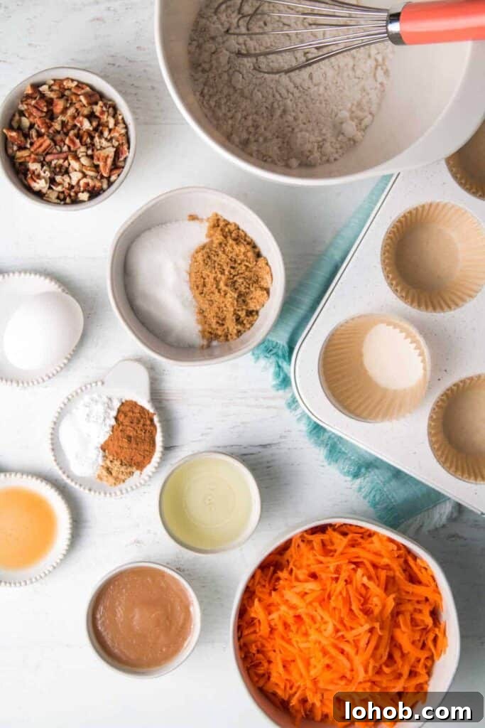 Dairy-Free Gluten-Free Carrot Muffins – Moist, Allergy-Friendly 3 Ingredients for gluten-free carrot muffins measured in bowls. A whisk rests in the bowl of flour.