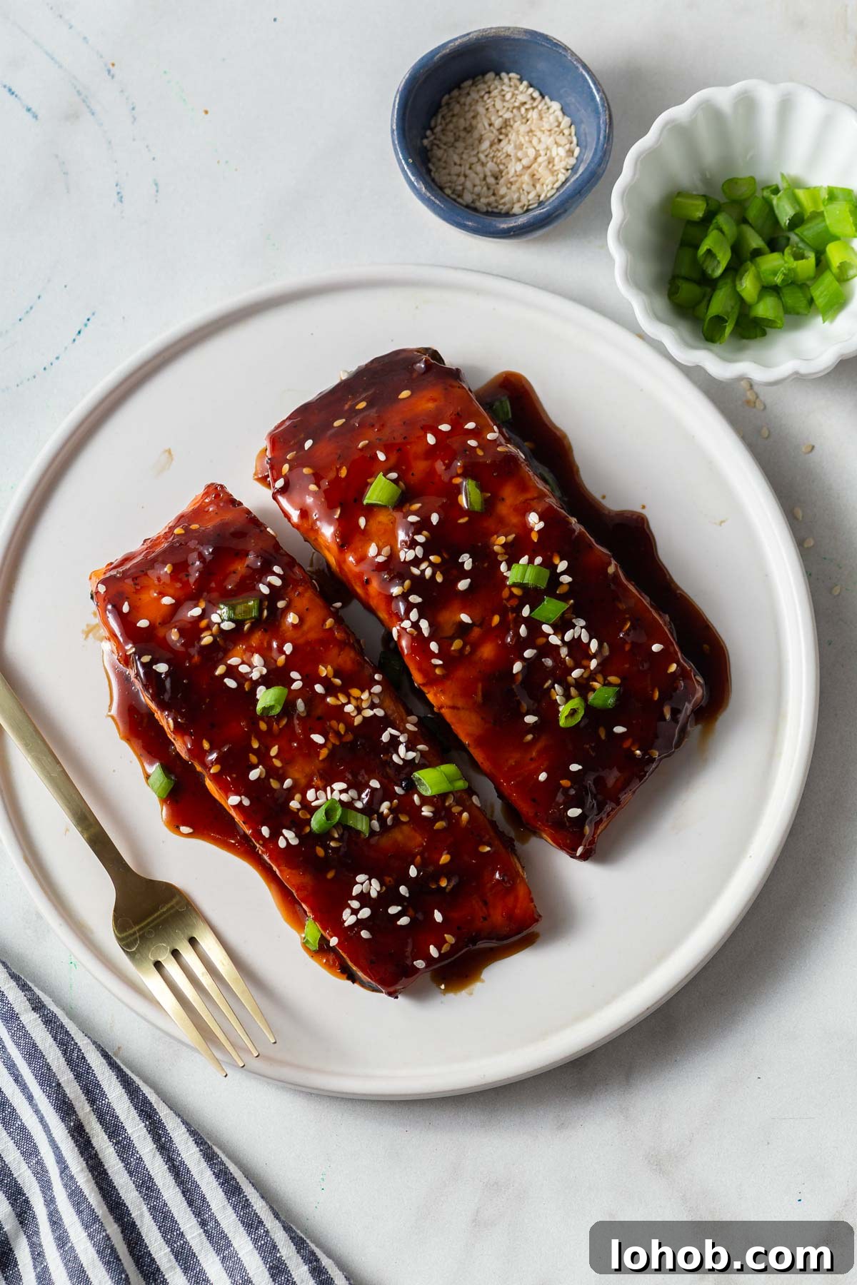 Crispy Air Fryer Teriyaki Salmon 11 air fryer teriyaki salmon with sesame seeds and green onions.