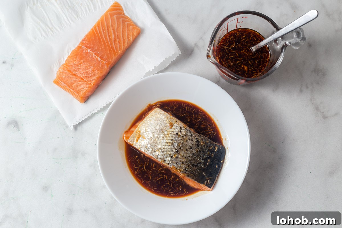 Crispy Air Fryer Teriyaki Salmon 5 marinating the salmon in teriyaki sauce.