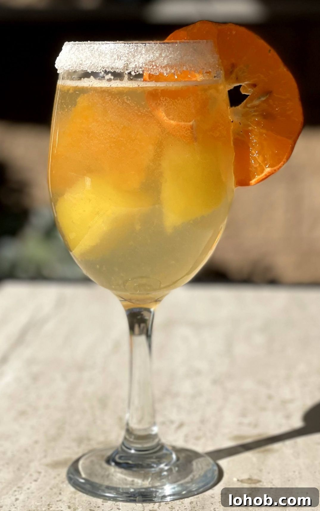 Citrus ice cubes in seltzer water