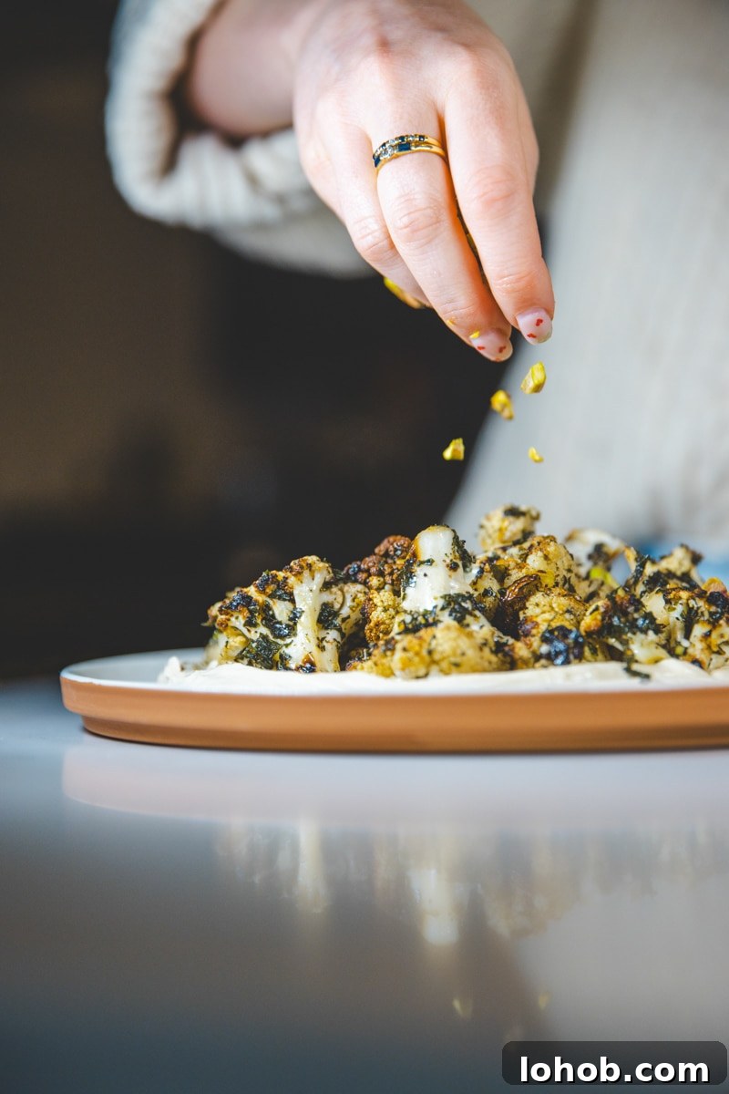 Herb-Marinated Cauliflower with Tofu Ricotta Recipe 3 sprinkling pistachios on Marinated Cauliflower & Tofu Ricotta - Georgie Eats