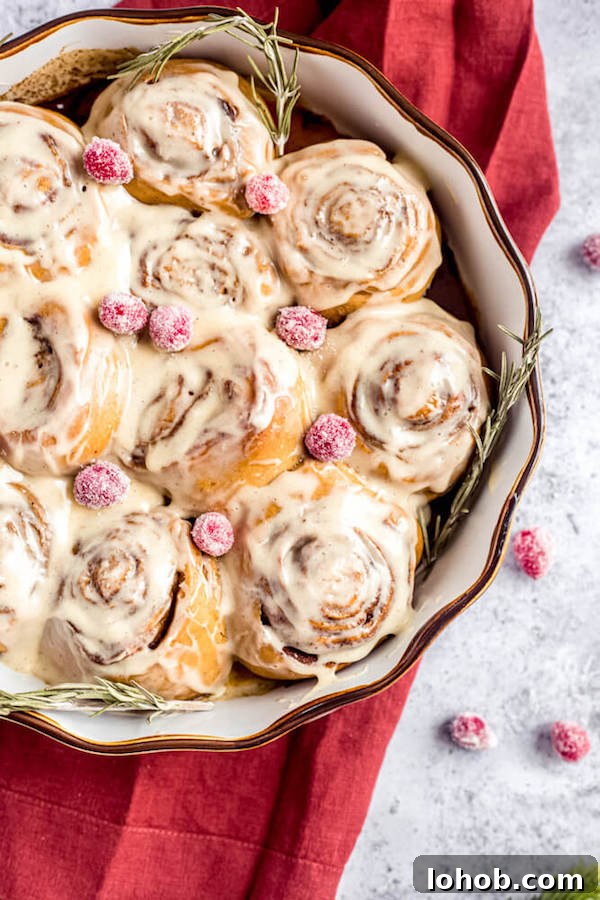 cinnamon rolls topped with sugared cranberries 