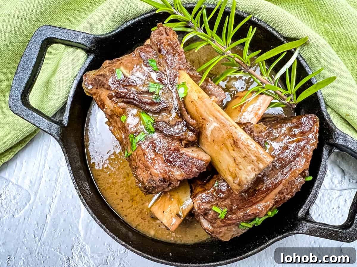 Braised Beef Short Ribs with gravy and mashed potatoes.