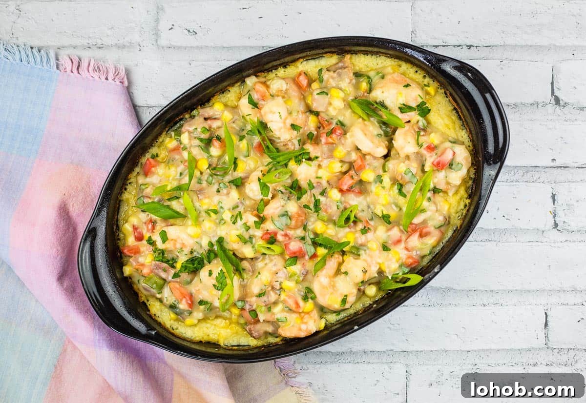 A casserole dish with chicken and vegetables in it.