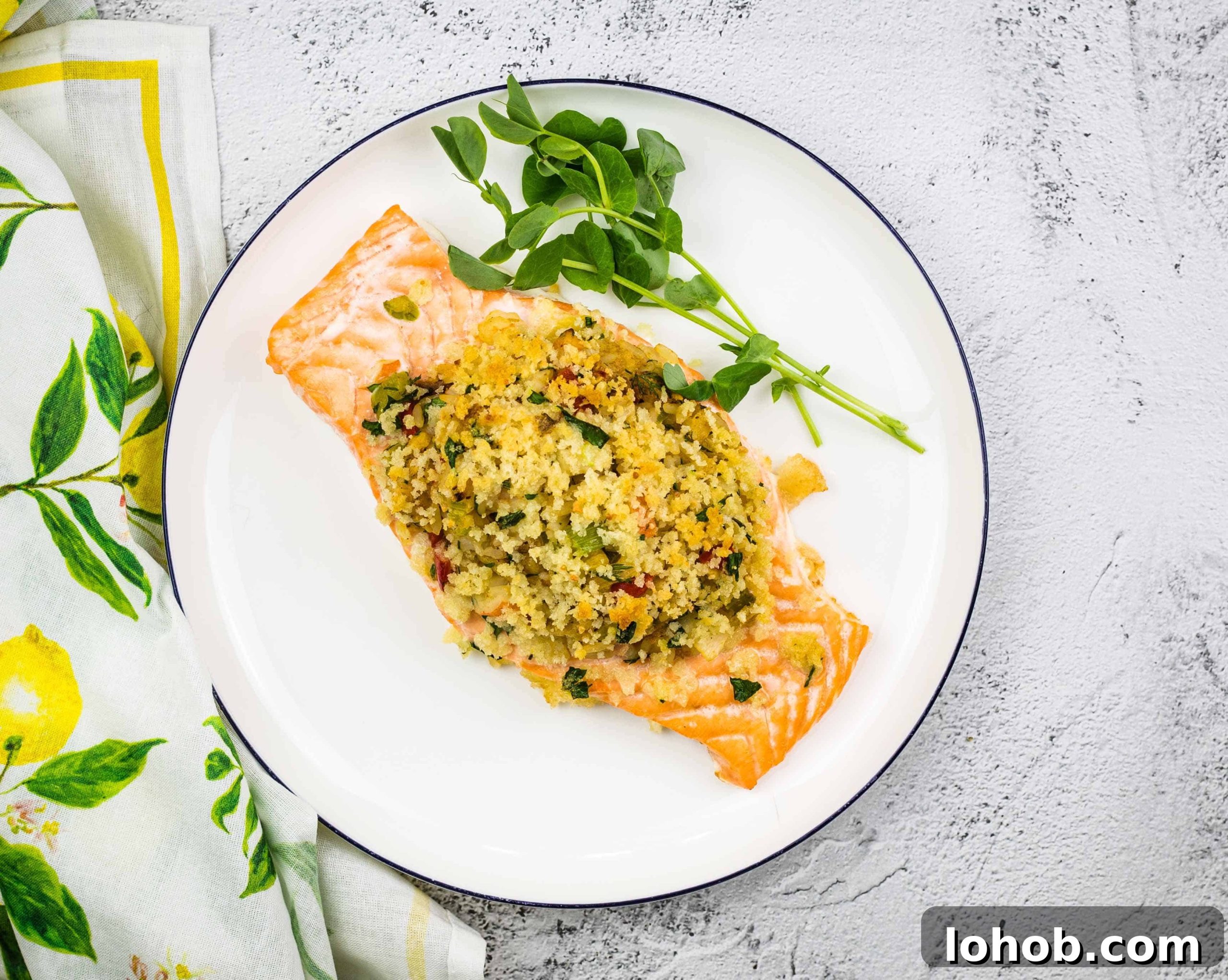 Seafood Stuffed Salmon on a circular white plate.