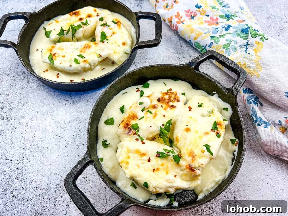 Giant Cheese Stuffed Pasta Shells in two black serving dishes.