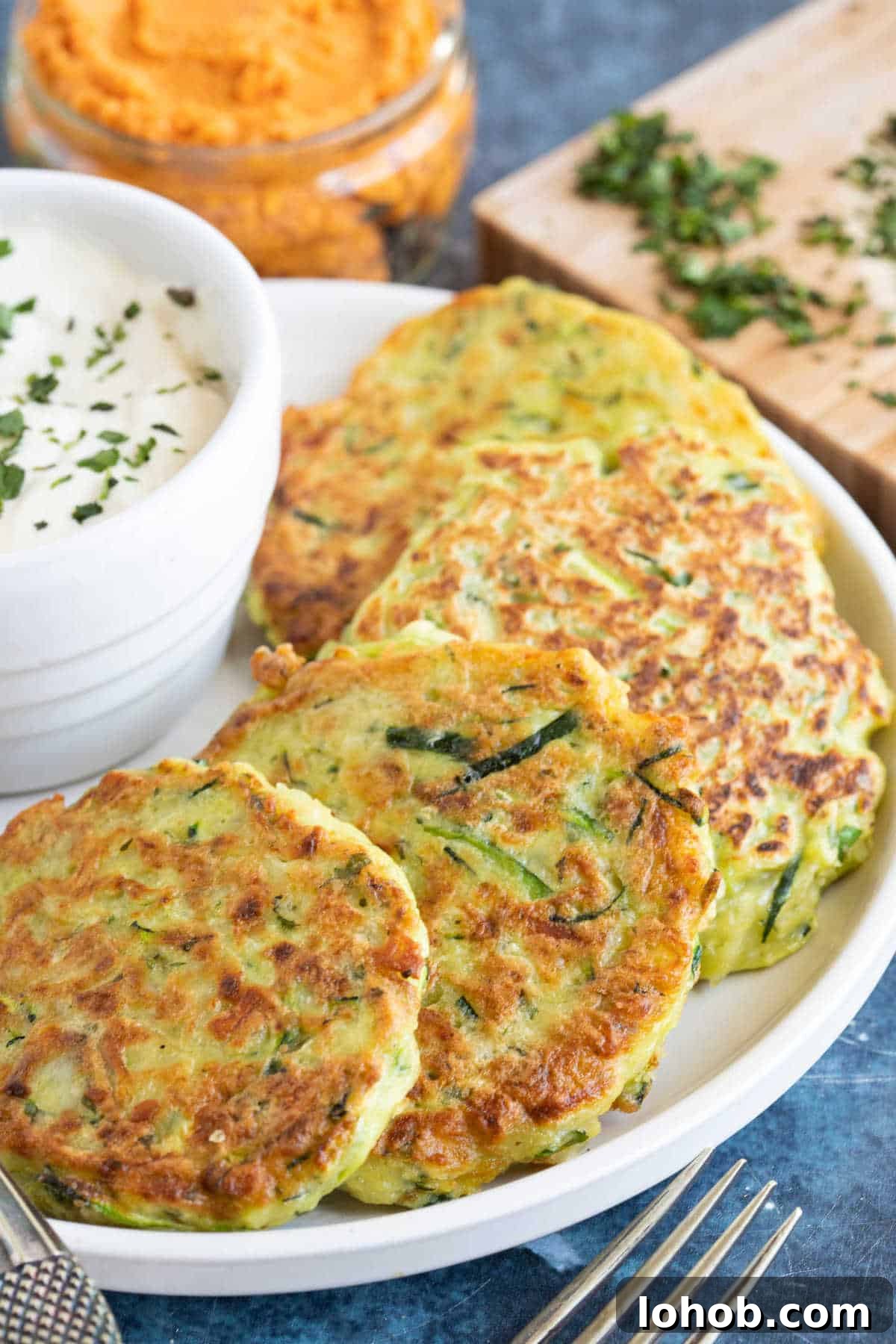 Cheesy Zucchini Fritters Recipe: Crispy Pan-Fried Rounds 2 Courgette and halloumi firtters.