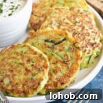 Cheesy Zucchini Fritters Recipe: Crispy Pan-Fried Rounds 6 Courgette fritters with a yogurt dip.