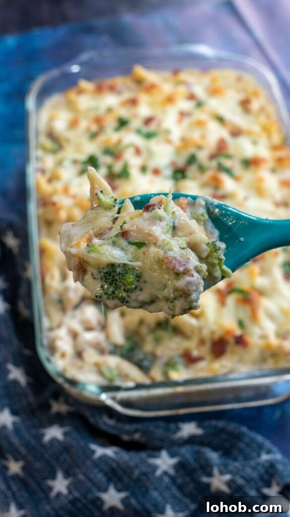 spoonful of alfredo penne pasta