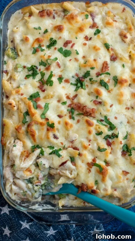 This baked Chicken Broccoli Alfredo Pasta is a hearty upgrade on your favorite fettuccini Alfredo recipe. Made with shredded chicken, crispy bacon, broccoli, homemade Alfredo sauce and tons of cheese, this cheesy chicken Alfredo casserole is an ultimate comfort food favorite!