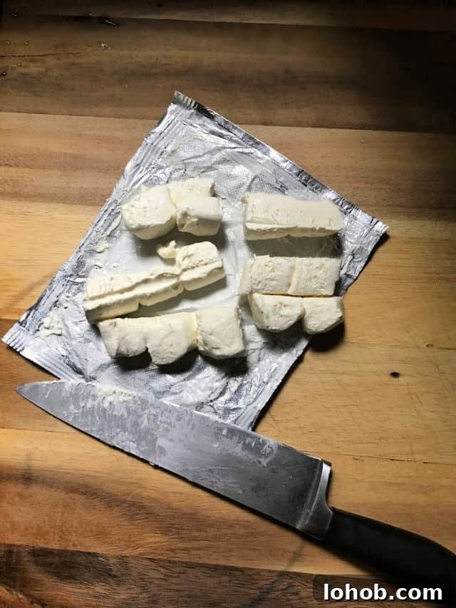 cream cheese cut into 1 inch cubes and knife