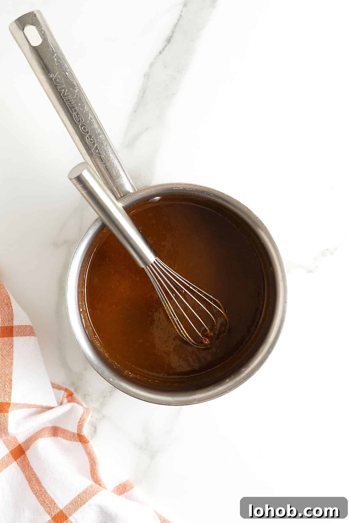 A saucepan of pumpkin spice syrup.