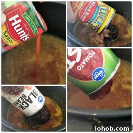 This spicy sausage, bean and pasta soup is the PERFECT weeknight dinner! It's so easy to make and is full of savory spicy delicious flavor! If you're looking for a delicious bean and sausage soup slow cooker recipe - this is the one!