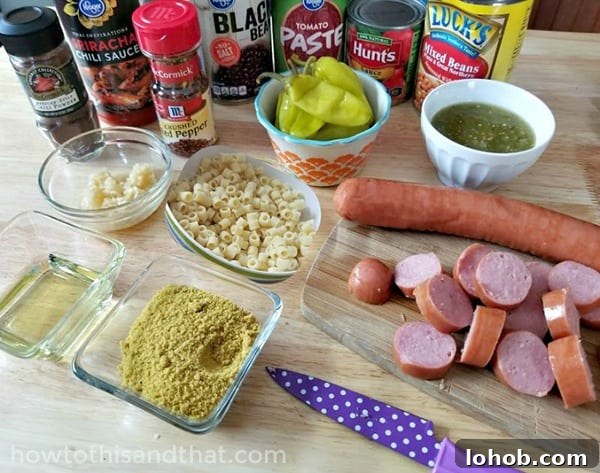 This spicy sausage, bean and pasta soup is the PERFECT weeknight dinner! It's so easy to make and is full of savory spicy delicious flavor! If you're looking for a delicious bean and sausage soup slow cooker recipe - this is the one!