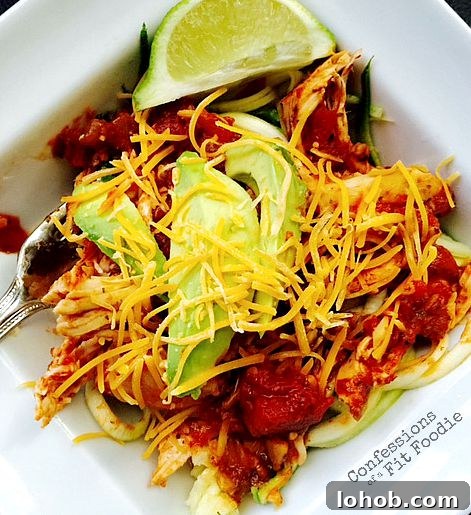 Top Weight Watchers Chicken Recipes: Quick Low-Point Meals 8 A square bowl filled with salsa lime chicken over zoodles, topped with avocado, shredded cheese and lime.