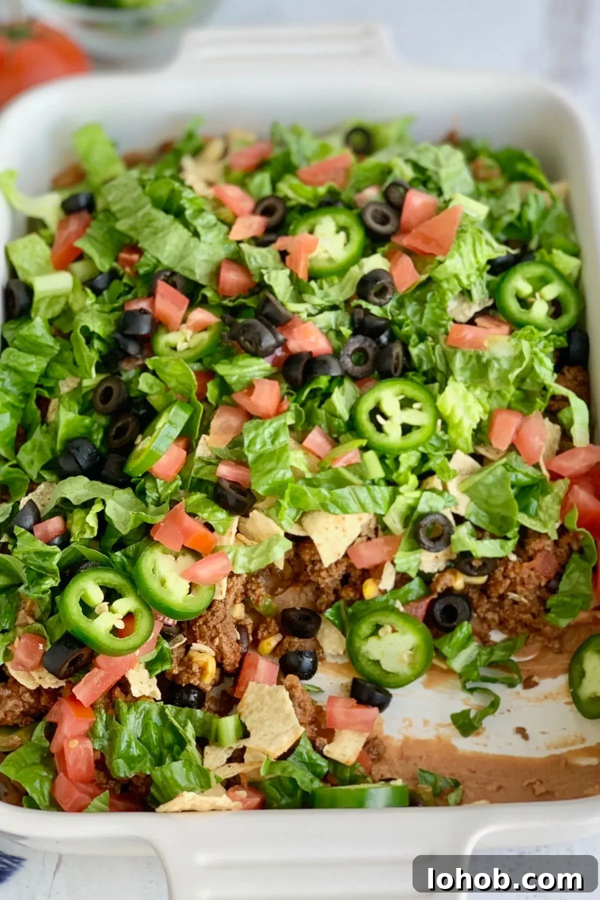 Gluten-Free Dairy-Free Taco Bake Recipe for Weeknight Dinners 6 A baking dish with a gluten and dairy free Taco Bake with some missing.