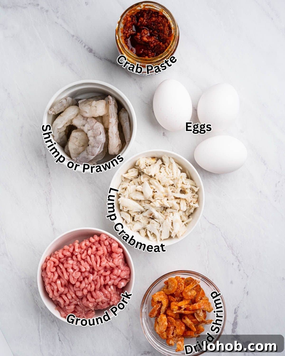 Ingredients for crab meatballs: ground pork, prawns, dried shrimp, lump crabmeat, eggs, and crab paste.