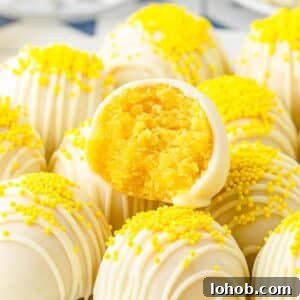 Front close up of Lemon Cake Balls a bite taken from one.