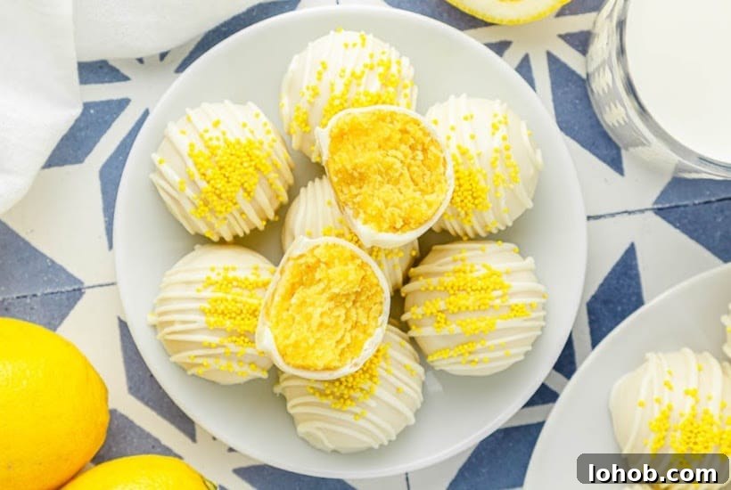 Overhead view of a plate of citrus cake bites, one split in half.