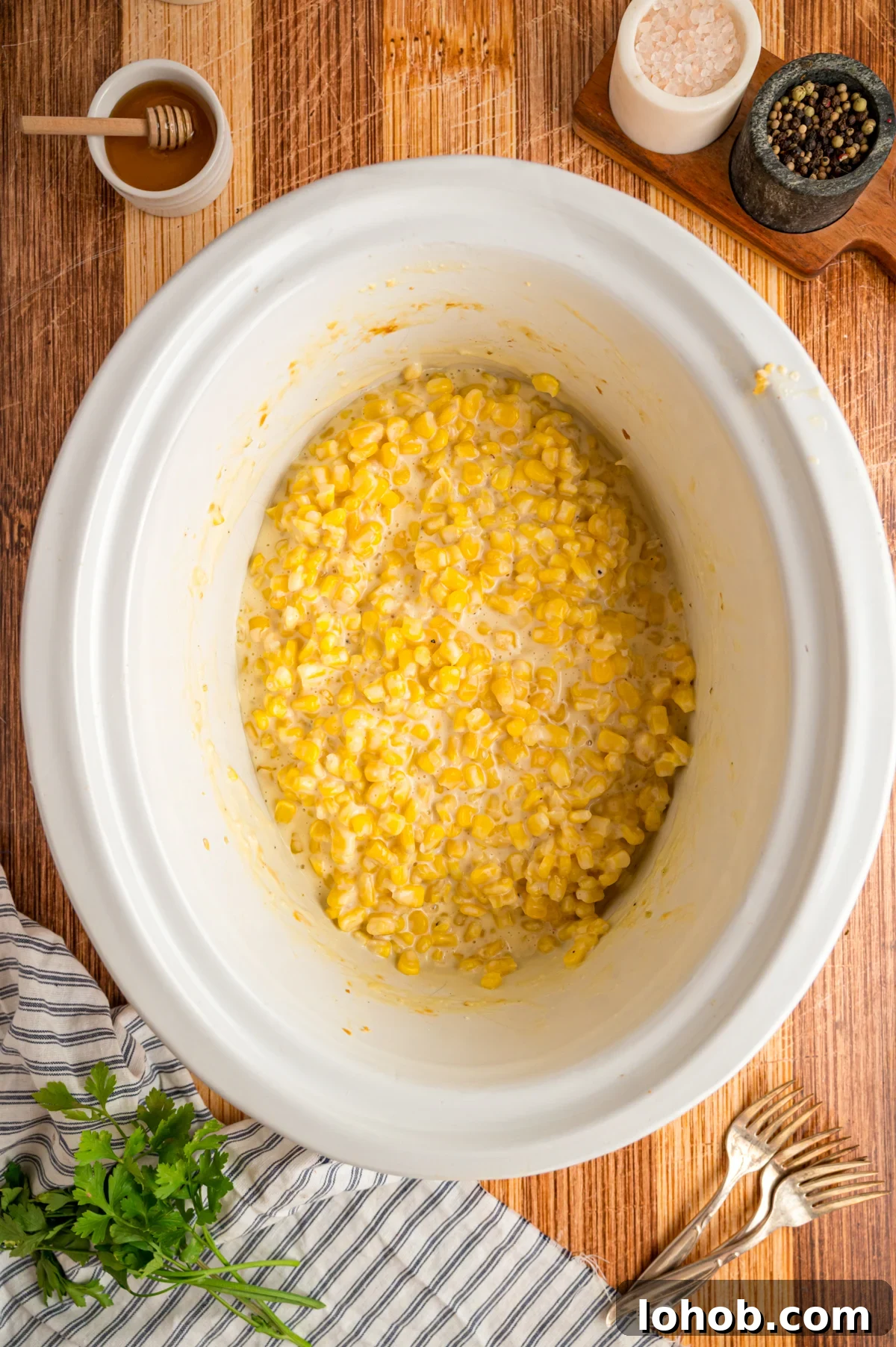 Slow cooker honey butter corn in a crockpot after cooking.