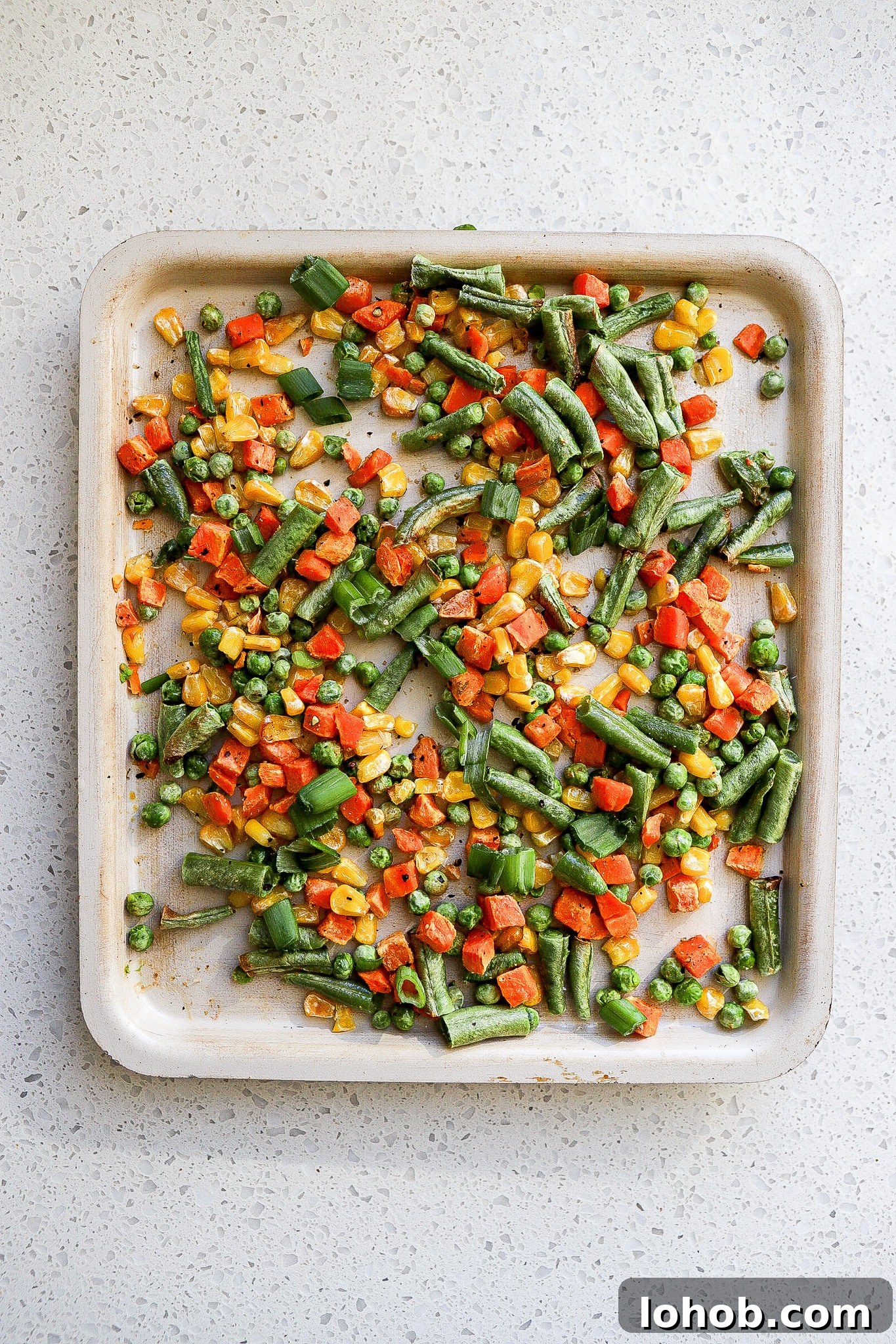 Air Fryer Frozen Vegetables: Quick Crispy Recipe 3 top down view of air fryer veggies with corn and green beans