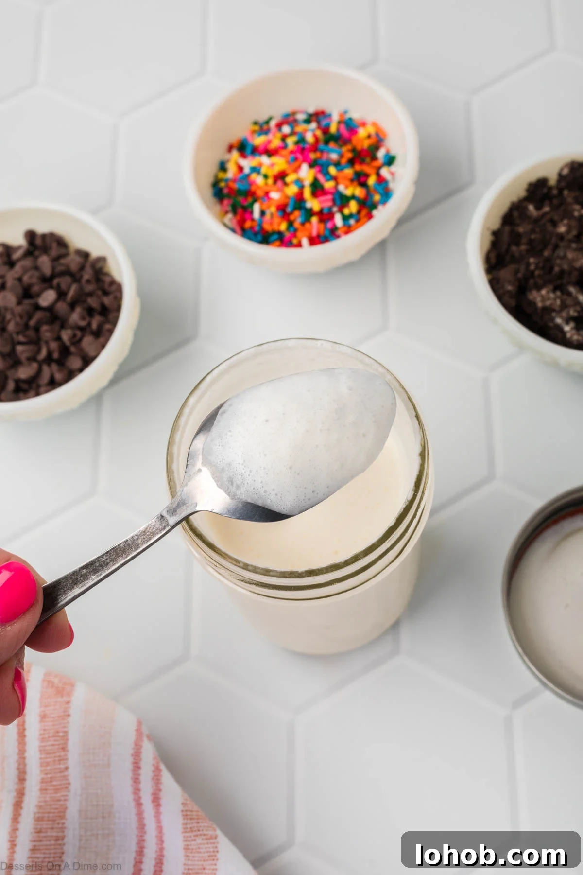 No-Churn Mason Jar Ice Cream Recipe 7 Spoon in jar coated with ice cream.