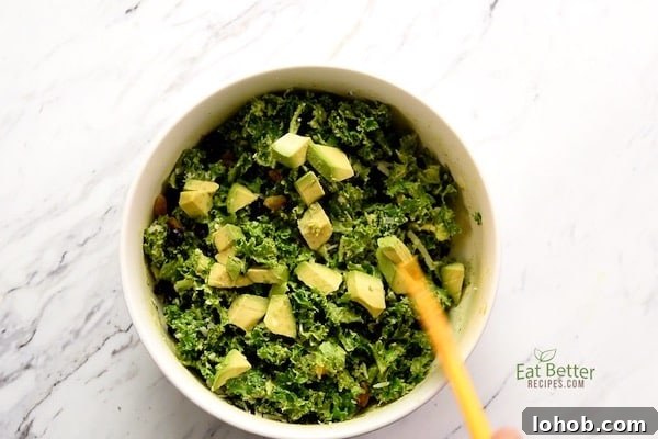 Creamy Avocado Massaged Kale Salad 6 Stirring the salad