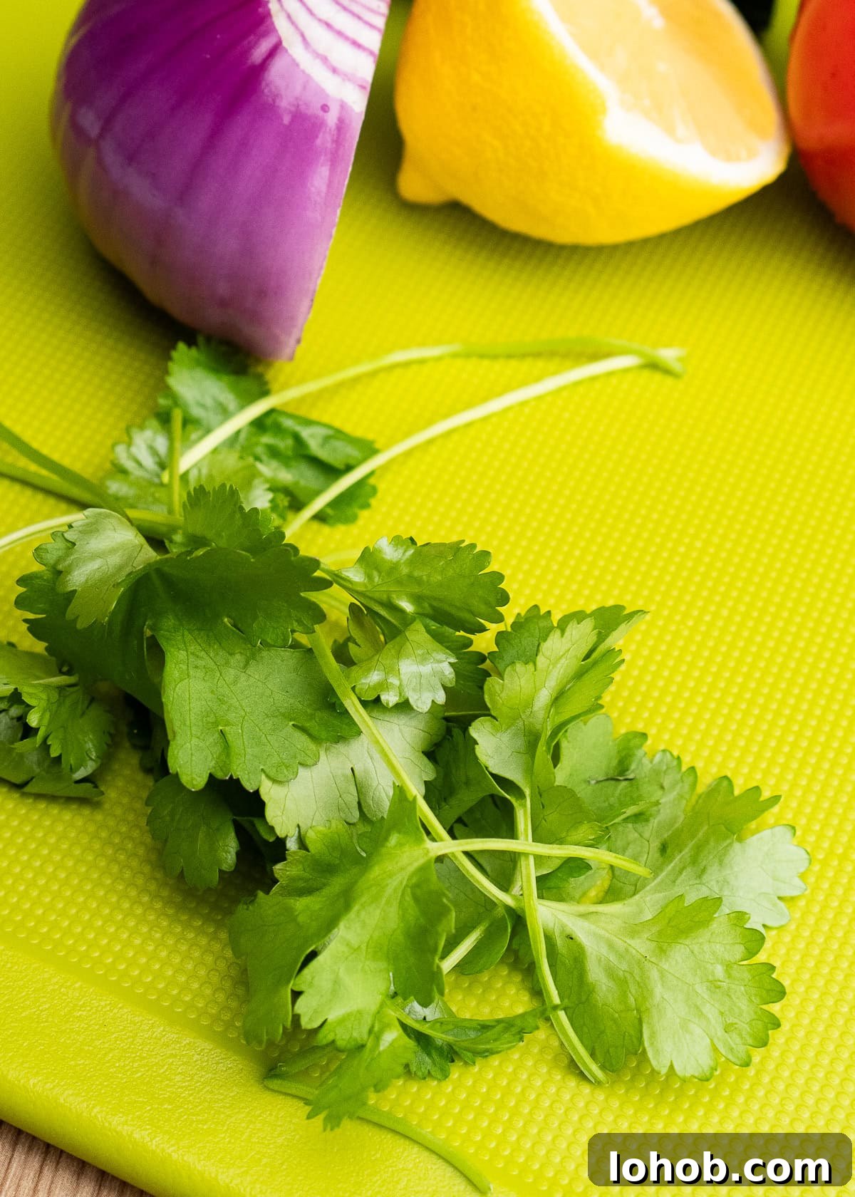 Kachumber: Tangy Indian Onion Salad 8 Fresh coriander on a chopping board
