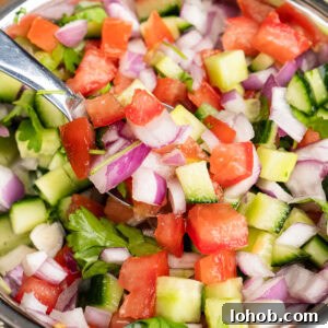 Kachumber: Tangy Indian Onion Salad 3 Indian Onion Salad being picked up with a spoon
