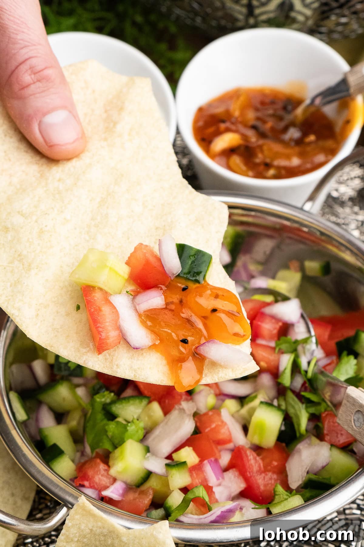 Kachumber: Tangy Indian Onion Salad 10 Indian Onion Salad with mango chutney on a poppadom