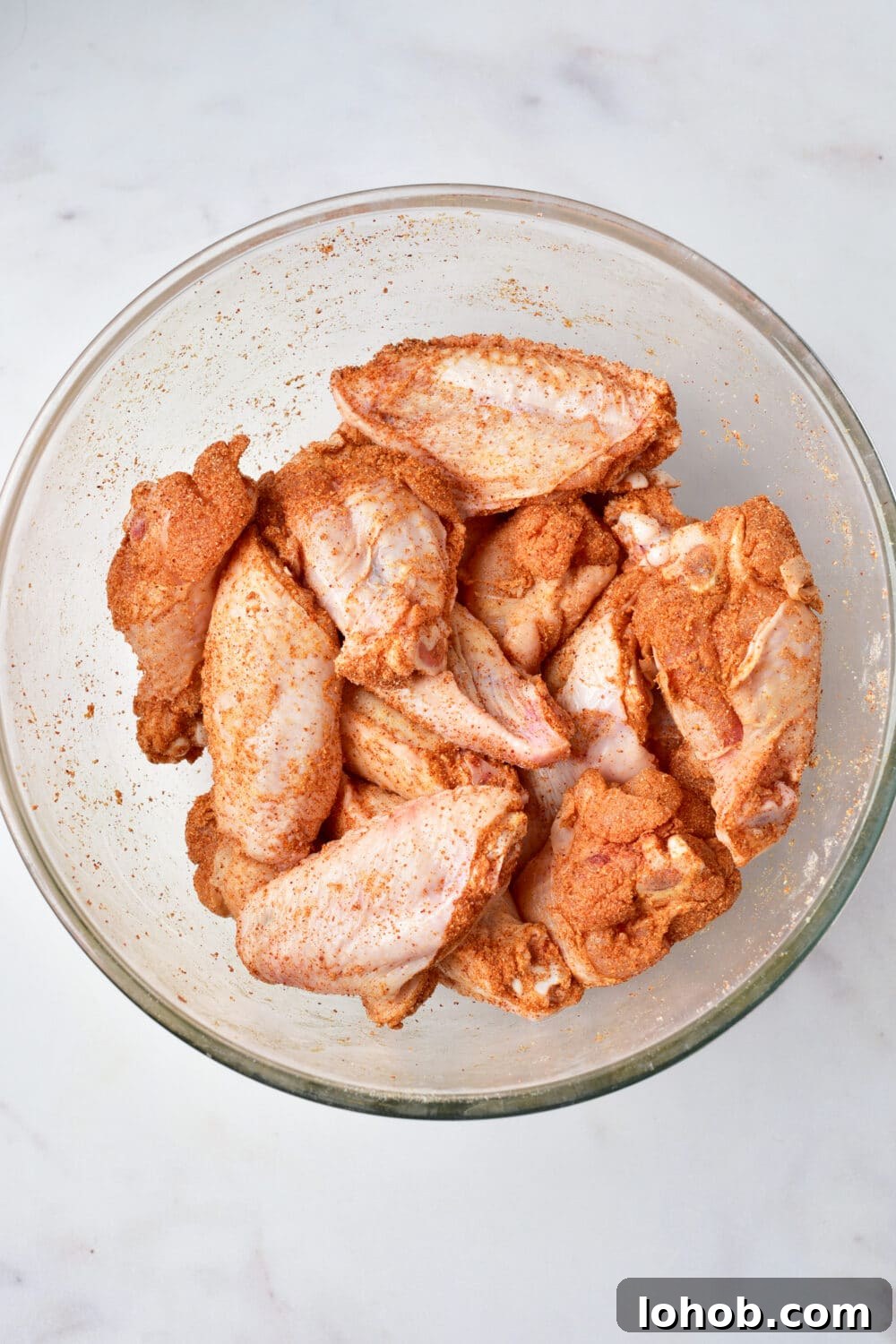 Crispy Baked Buffalo Wings Recipe 7 coated raw chicken wings with spices