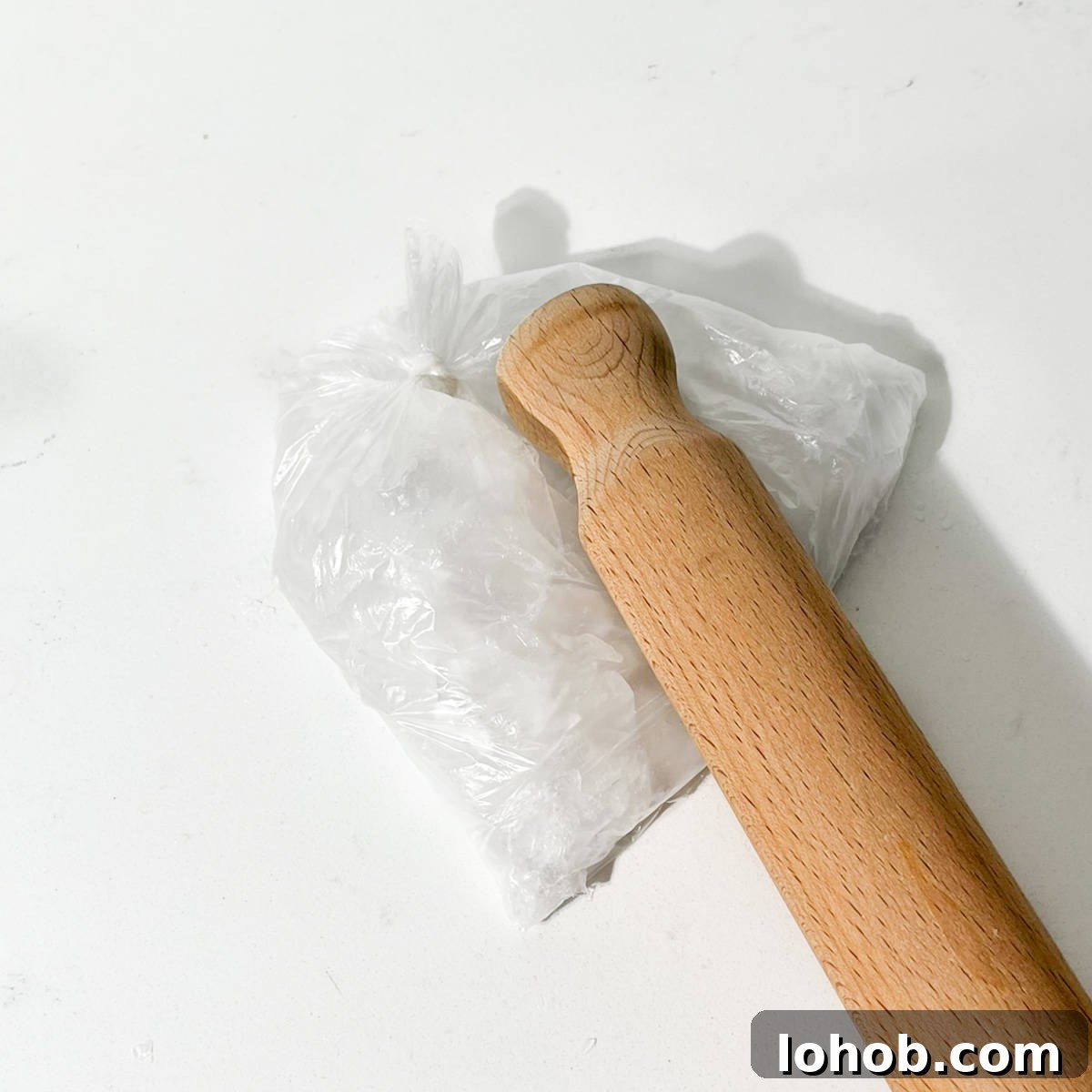 Vietnamese Iced Coffee with Condensed Milk (Cà Phê Sữa Đá) 4 Bashing ice with a rolling pin.