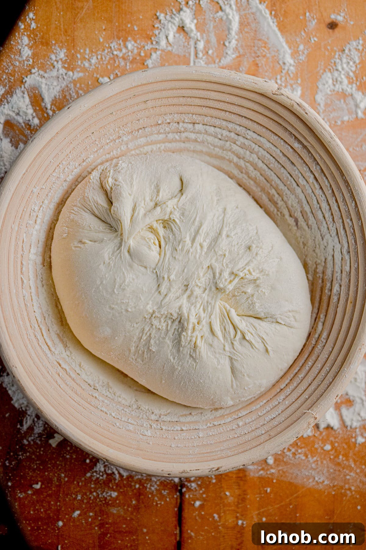 Sourdough Hydration: Mastering Dough Water Ratios 8 The dough is in a bread basket.