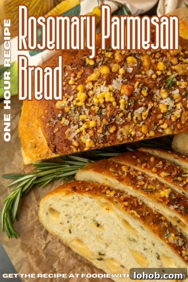 Rosemary Parmesan Loaf with Crispy Herb Crust 11 partially sliced one hour rosemary parmesan bread on parchment paper with text describing the photo over it