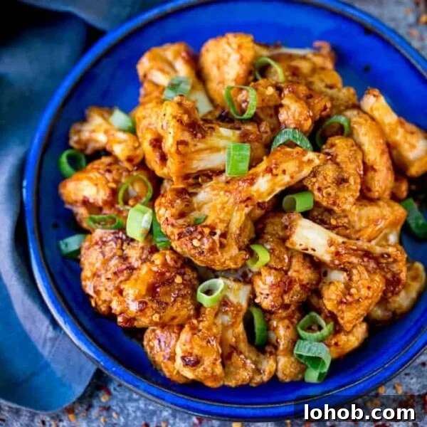 Smoky Roasted Cauliflower Salad with Garlic Lemon Dressing 5 Square photo of Asian cauliflower wings on a blue plate