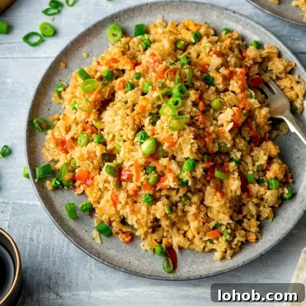 Smoky Roasted Cauliflower Salad with Garlic Lemon Dressing 8 Cauliflower fried rice on a grey plate on a light background