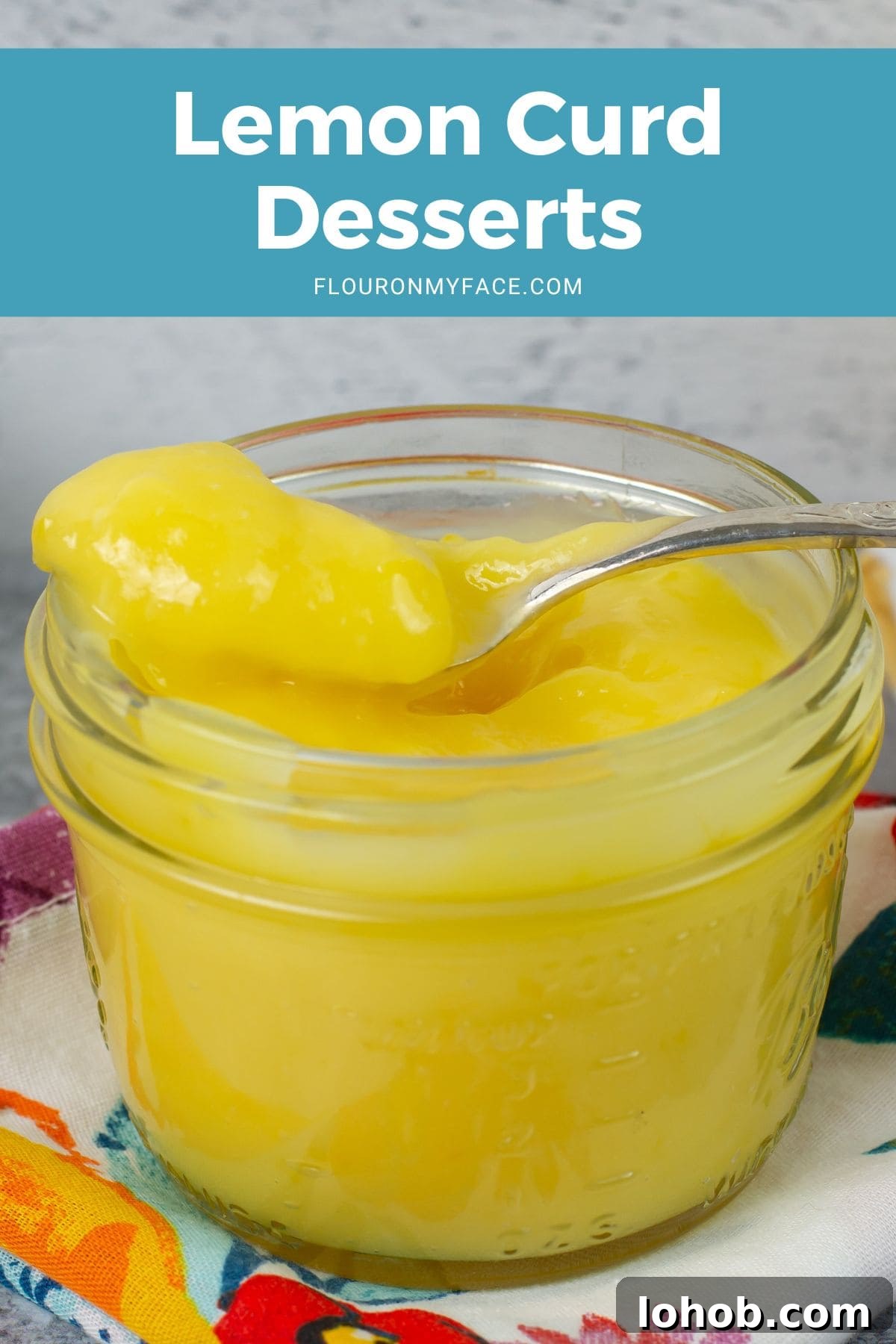 Zesty Lemon Curd Desserts to Brighten Any Table 4 Closeup of a jar of homemade lemon curd, spoon resting on the lip.