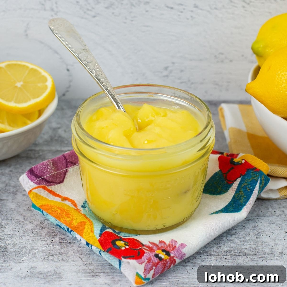 Zesty Lemon Curd Desserts to Brighten Any Table 3 Homemade lemon curd in a glass jar.